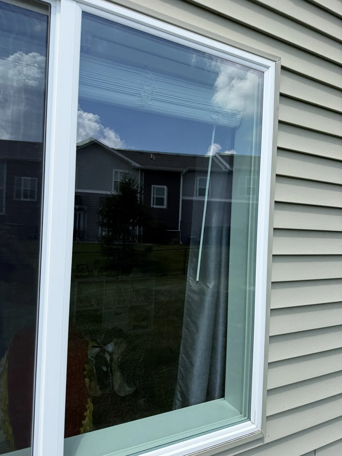 Clean exterior window with sky reflection